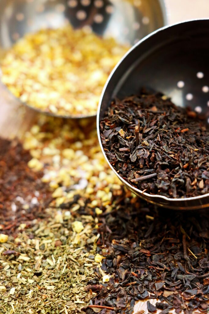 pexels-photo-20535021-20535021 Close-up shot of assorted loose leaf teas and herbs in a stainless steel strainer.